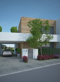Alçado frontal de moradia moderna de dois pisos com garagem